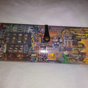 Hard case New York clutch purse with strap. 12x4.